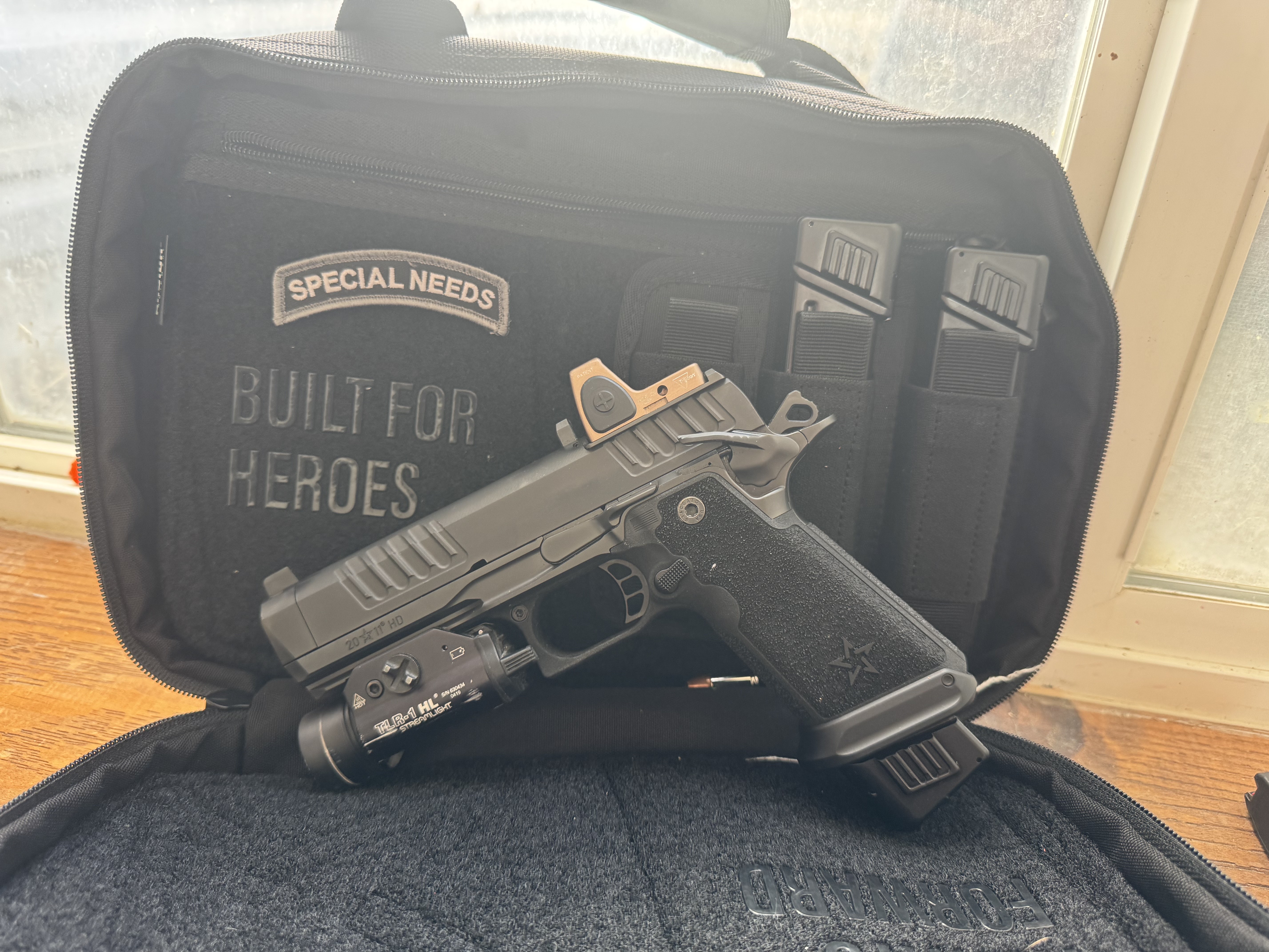 Staccato HD 4.5 duty pistol with weapon light, optic, magazines, and carry case