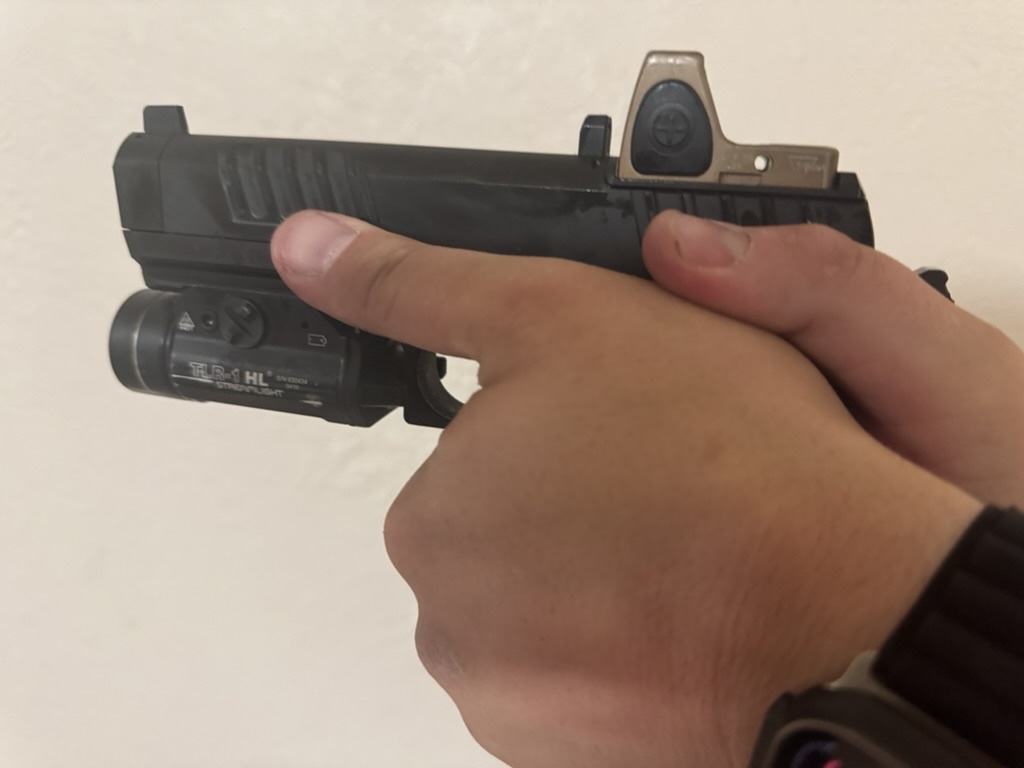 Two-handed presentation of the Staccato HD 4.5 showing its grip geometry and controls